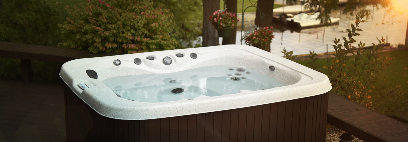 A family enjoying a getaway series hot tub by master spas