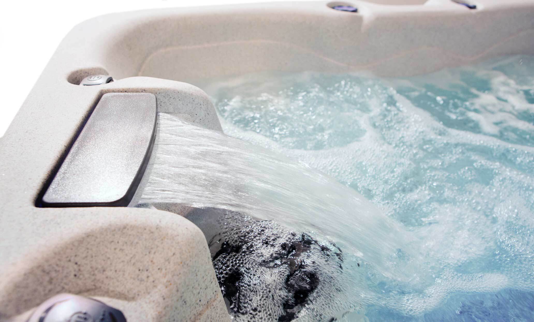 Waterfall water feature on a getaway hot tub